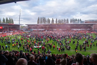260425 - Wrexham v Charlton Athletic - Sky Bet League 1 - Wrexham fans celebrate at full time following their promotion securing victory over Charlton