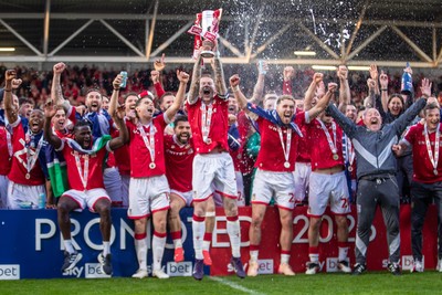 260425 - Wrexham v Charlton Athletic - Sky Bet League 1 - James McClean of Wrexham AFC lifts the Sky Bet League 1 promotion trophy following the victory over Charlton