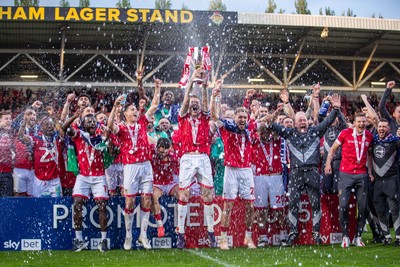 260425 - Wrexham v Charlton Athletic - Sky Bet League 1 - James McClean of Wrexham AFC lifts the Sky Bet League 1 promotion trophy following the victory over Charlton