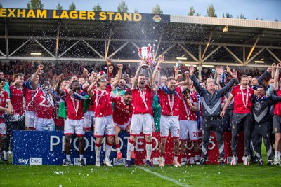 260425 - Wrexham v Charlton Athletic - Sky Bet League 1 - James McClean of Wrexham AFC lifts the Sky Bet League 1 promotion trophy following the victory over Charlton