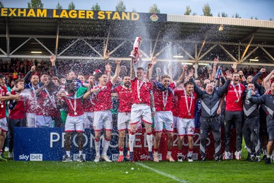 260425 - Wrexham v Charlton Athletic - Sky Bet League 1 - James McClean of Wrexham AFC lifts the Sky Bet League 1 promotion trophy following the victory over Charlton