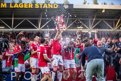 260425 - Wrexham v Charlton Athletic - Sky Bet League 1 - James McClean of Wrexham AFC lifts the Sky Bet League 1 promotion trophy following the victory over Charlton