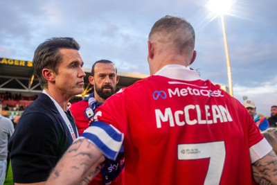 260425 - Wrexham v Charlton Athletic - Sky Bet League 1 - Wrexham co-owner Rob McElheney celebrates promotion with players