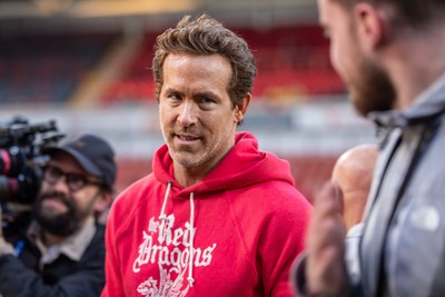 260425 - Wrexham v Charlton Athletic - Sky Bet League 1 - Wrexham Co-Owner Ryan Reynolds celebrates following the Wrexham victory over Charlton