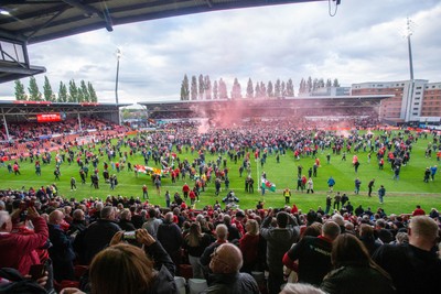 260425 - Wrexham v Charlton Athletic - Sky Bet League 1 - Wrexham fans celebrate promotion following the full time whistle