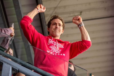 260425 - Wrexham v Charlton Athletic - Sky Bet League 1 - Wrexham co-owner Ryan Reynolds celebrates Wrexham’s promotion