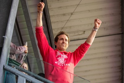 260425 - Wrexham v Charlton Athletic - Sky Bet League 1 - Wrexham co-owner Ryan Reynolds celebrates Wrexham’s promotion