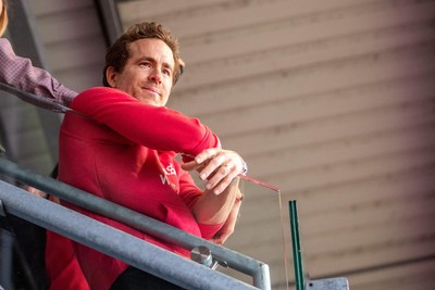 260425 - Wrexham v Charlton Athletic - Sky Bet League 1 - Wrexham co-owner Ryan Reynolds celebrates Wrexham’s promotion