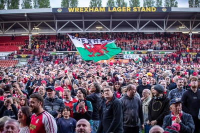 260425 - Wrexham v Charlton Athletic - Sky Bet League 1 - Wrexham fans celebrate their promotion at full time