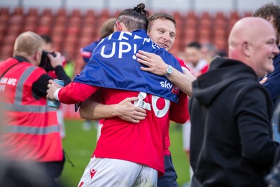 260425 - Wrexham v Charlton Athletic - Sky Bet League 1 - Wrexham players celebrate their promotion at full time