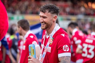 260425 - Wrexham v Charlton Athletic - Sky Bet League 1 - Wrexham players celebrate their promotion at full time