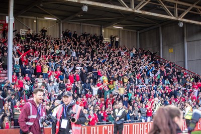 260425 - Wrexham v Charlton Athletic - Sky Bet League 1 - Wrexham fans celebrate their promotion at full time
