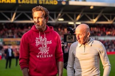 260425 - Wrexham v Charlton Athletic - Sky Bet League 1 - Wrexham co-owner Ryan Reynolds with ex-player Mickey Thomas