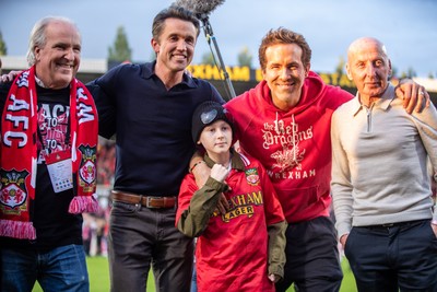 260425 - Wrexham v Charlton Athletic - Sky Bet League 1 - Wrexham Co-Owners Rob McElheney, Ryan Reynolds and ex-Wrexham player Mickey Thomas following Wrexham’s victory over Charlton