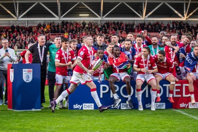 260425 - Wrexham v Charlton Athletic - Sky Bet League 1 - James McClean of Wrexham AFC lifts the Sky Bet League 1 Promotion trophy