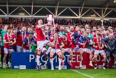260425 - Wrexham v Charlton Athletic - Sky Bet League 1 - James McClean of Wrexham AFC lifts the Sky Bet League 1 Promotion trophy