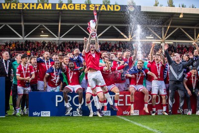 260425 - Wrexham v Charlton Athletic - Sky Bet League 1 - James McClean of Wrexham AFC lifts the Sky Bet League 1 Promotion trophy