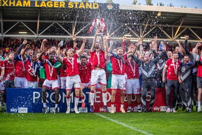 260425 - Wrexham v Charlton Athletic - Sky Bet League 1 - James McClean of Wrexham AFC lifts the Sky Bet League 1 Promotion trophy