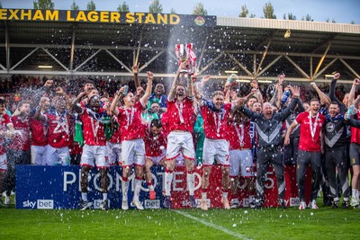 260425 - Wrexham v Charlton Athletic - Sky Bet League 1 - James McClean of Wrexham AFC lifts the Sky Bet League 1 Promotion trophy