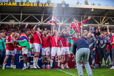 260425 - Wrexham v Charlton Athletic - Sky Bet League 1 - James McClean of Wrexham AFC lifts the Sky Bet League 1 Promotion trophy