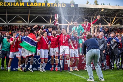 260425 - Wrexham v Charlton Athletic - Sky Bet League 1 - James McClean of Wrexham AFC lifts the Sky Bet League 1 Promotion trophy