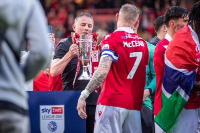 260425 - Wrexham v Charlton Athletic - Sky Bet League 1 - Wrexham Manager, Phil Parkinson with the Sky Bet League 1 Promotion trophy