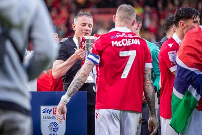 260425 - Wrexham v Charlton Athletic - Sky Bet League 1 - Wrexham Manager, Phil Parkinson with the Sky Bet League 1 Promotion trophy