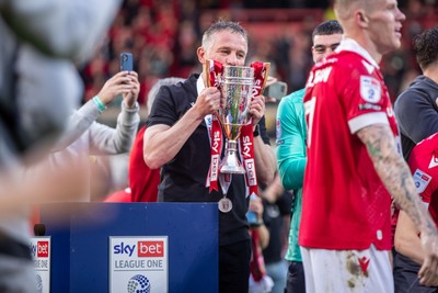 260425 - Wrexham v Charlton Athletic - Sky Bet League 1 - Wrexham Manager, Phil Parkinson with the Sky Bet League 1 Promotion trophy