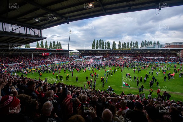 260425 - Wrexham v Charlton Athletic - Sky Bet League 1 - Wrexham fans celebrate at full time following their promotion securing victory over Charlton