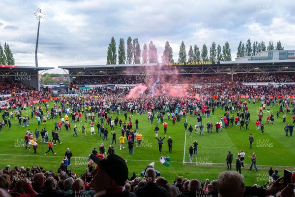 260425 - Wrexham v Charlton Athletic - Sky Bet League 1 - Wrexham fans celebrate at full time following their promotion securing victory over Charlton