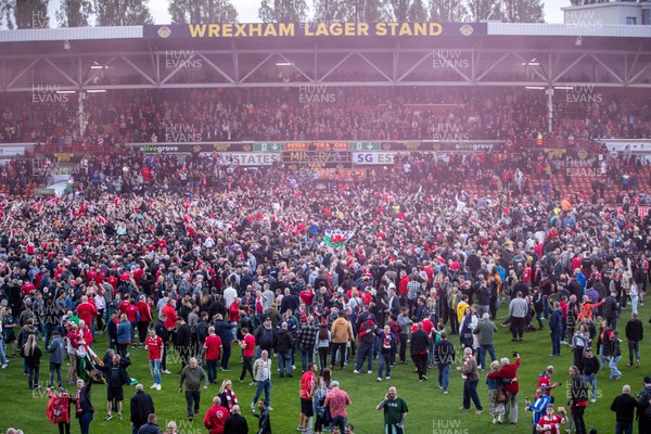 260425 - Wrexham v Charlton Athletic - Sky Bet League 1 - Wrexham fans celebrate promotion at full time