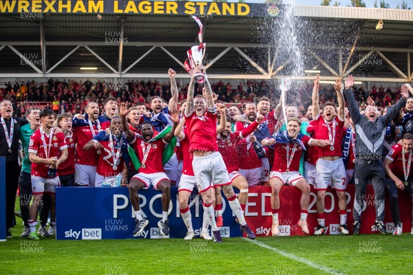 260425 - Wrexham v Charlton Athletic - Sky Bet League 1 - James McClean of Wrexham AFC lifts the Sky Bet League 1 promotion trophy following the victory over Charlton