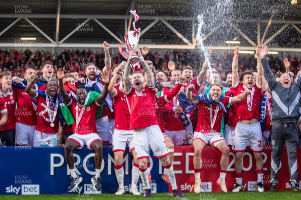 260425 - Wrexham v Charlton Athletic - Sky Bet League 1 - James McClean of Wrexham AFC lifts the Sky Bet League 1 promotion trophy following the victory over Charlton