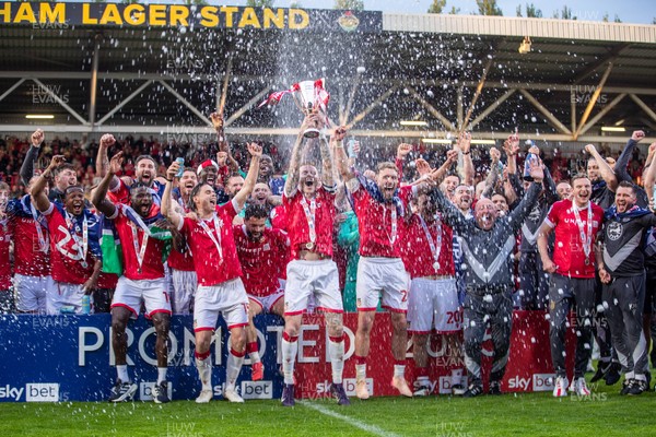260425 - Wrexham v Charlton Athletic - Sky Bet League 1 - James McClean of Wrexham AFC lifts the Sky Bet League 1 promotion trophy following the victory over Charlton