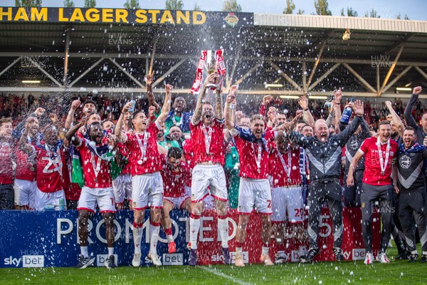 260425 - Wrexham v Charlton Athletic - Sky Bet League 1 - James McClean of Wrexham AFC lifts the Sky Bet League 1 promotion trophy following the victory over Charlton