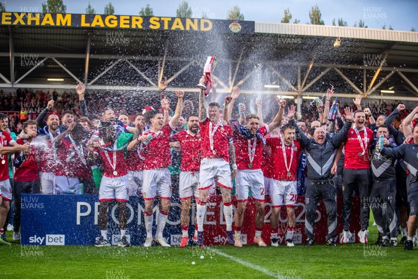 260425 - Wrexham v Charlton Athletic - Sky Bet League 1 - James McClean of Wrexham AFC lifts the Sky Bet League 1 promotion trophy following the victory over Charlton