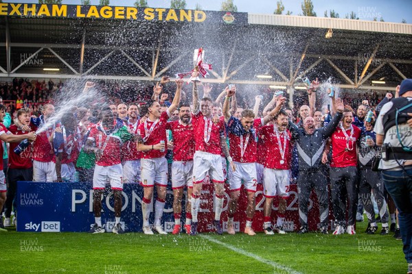 260425 - Wrexham v Charlton Athletic - Sky Bet League 1 - James McClean of Wrexham AFC lifts the Sky Bet League 1 promotion trophy following the victory over Charlton