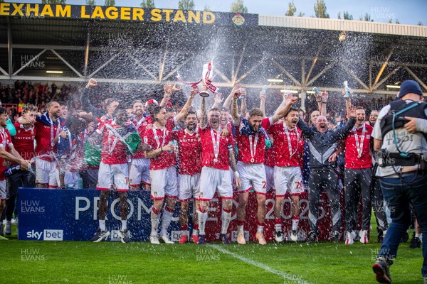 260425 - Wrexham v Charlton Athletic - Sky Bet League 1 - James McClean of Wrexham AFC lifts the Sky Bet League 1 promotion trophy following the victory over Charlton
