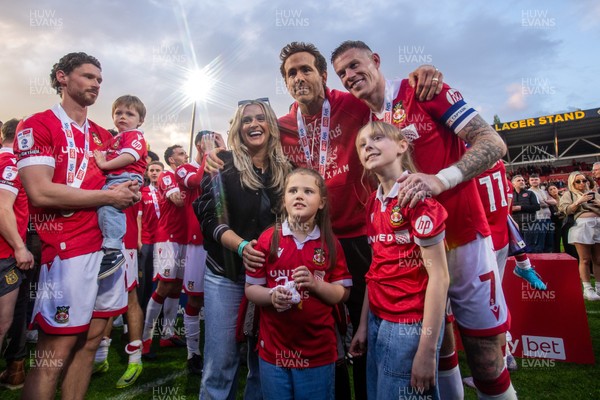 260425 - Wrexham v Charlton Athletic - Sky Bet League 1 - Wrexham co-owner Ryan Reynolds celebrates promotion with players and their families