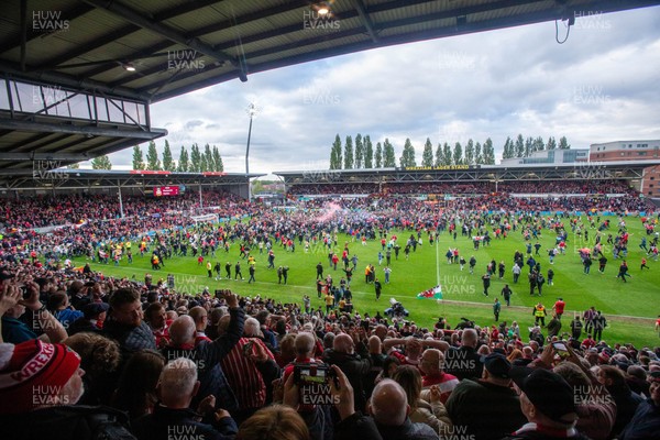 260425 - Wrexham v Charlton Athletic - Sky Bet League 1 - Wrexham fans celebrate promotion following the full time whistle