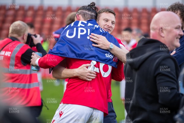 260425 - Wrexham v Charlton Athletic - Sky Bet League 1 - Wrexham players celebrate their promotion at full time