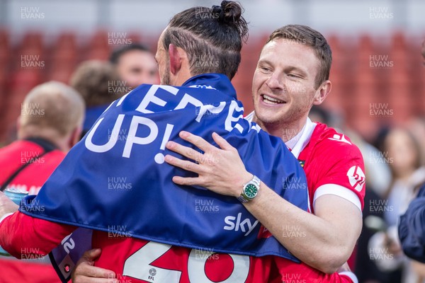 260425 - Wrexham v Charlton Athletic - Sky Bet League 1 - Wrexham players celebrate their promotion at full time