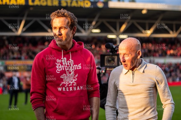 260425 - Wrexham v Charlton Athletic - Sky Bet League 1 - Wrexham co-owner Ryan Reynolds with ex-player Mickey Thomas