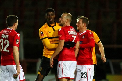 011218  Wrexham AFC v Newport County - Emirates FA Cup - Round 2 -  Tyreeq Bakinson of Newport County and Luke Summerfield of Wrexham have a disagreement  