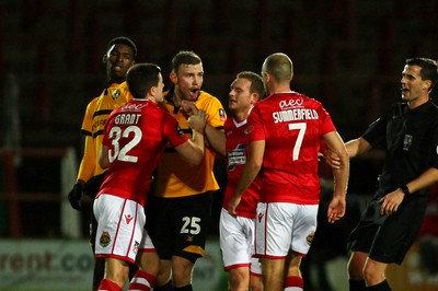 011218  Wrexham AFC v Newport County - Emirates FA Cup - Round 2 -  Heatd wods from Mark O Brien of Newport County and Luke Summerfield of Wrexham  