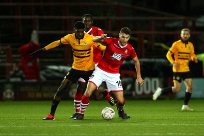 011218  Wrexham AFC v Newport County - Emirates FA Cup - Round 2 -  Tyreeq Bakinson of Newport County loses out to Brad Walker of Wrexham