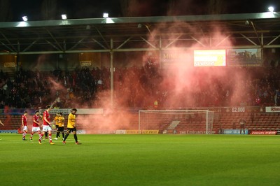 011218  Wrexham AFC v Newport County - Emirates FA Cup - Round 2 -  A flare is thrown onto the pitch near Joe Day of Newport County