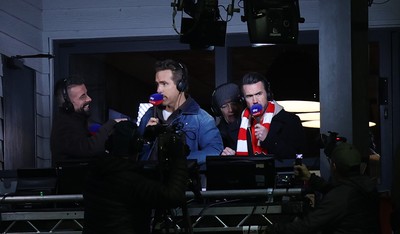 130326 - Wrexham v Swansea City - Sky Bet Championship - Wrexham owners Ryan Reynolds and Rob McElhenney in the gantry preparing to broadcast the match for Sky