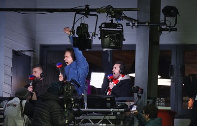 130326 - Wrexham v Swansea City - Sky Bet Championship - Wrexham owners Ryan Reynolds and Rob McElhenney celebrate Wrexham’s first goal in the gantry while broadcasting on Sky