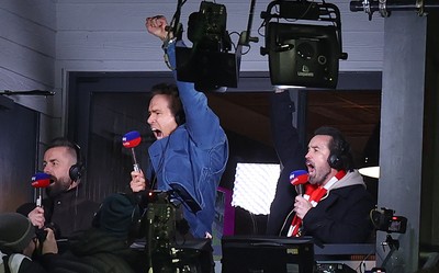130326 - Wrexham v Swansea City - Sky Bet Championship - Wrexham owners Ryan Reynolds and Rob McElhenney celebrate Wrexham’s first goal in the gantry while broadcasting on Sky